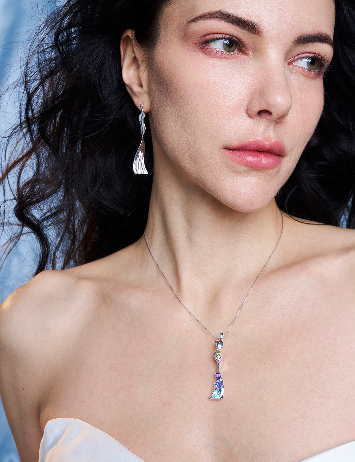 Close-up of model wearing Venus sterling silver earrings